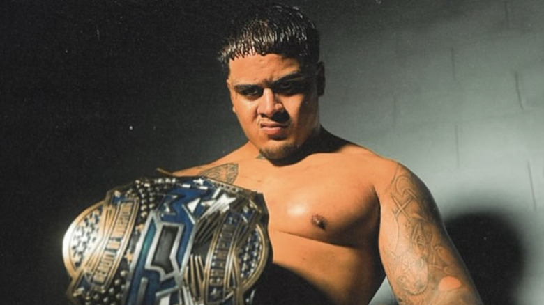 Zilla Fatu poses as the Reality of Wrestling Champion.