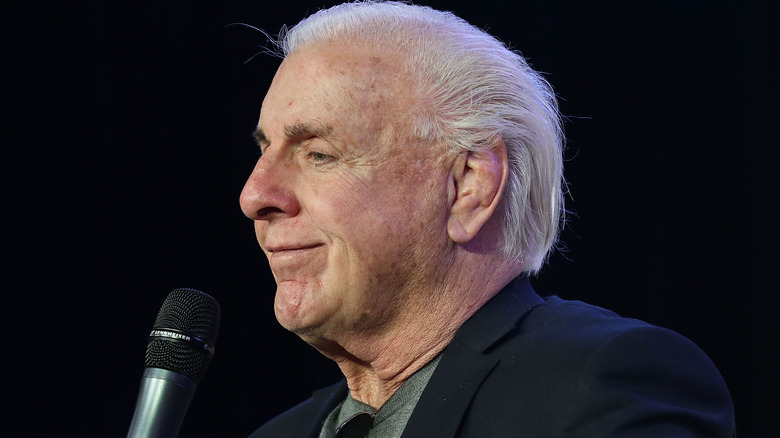 Ric Flair holding a microphone