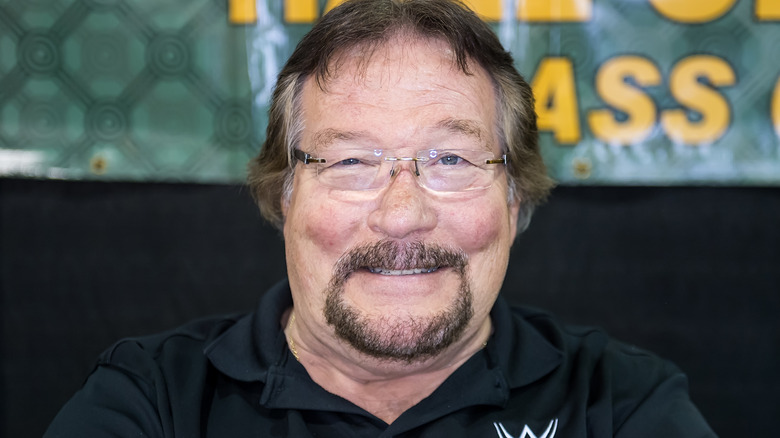 WWE Hall of Famer Ted DiBiase smiling for a photograph