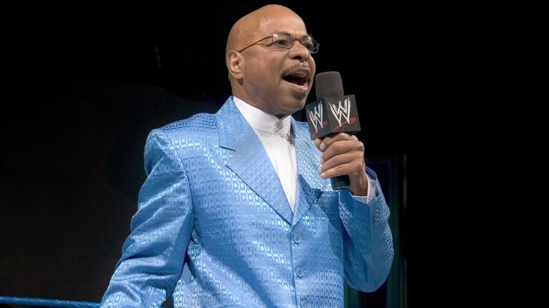 Teddy Long talking into a microphone