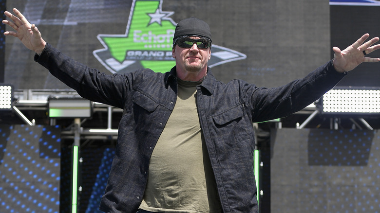 Professional wrestler The Undertaker walks onstage during pre-race ceremonies prior to the NASCAR Cup Series Echopark Automotive Grand Prix at Circuit of The Americas on March 27, 2022 in Austin, Texas.