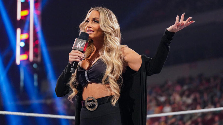 Trish Stratus speaks on the microphone.