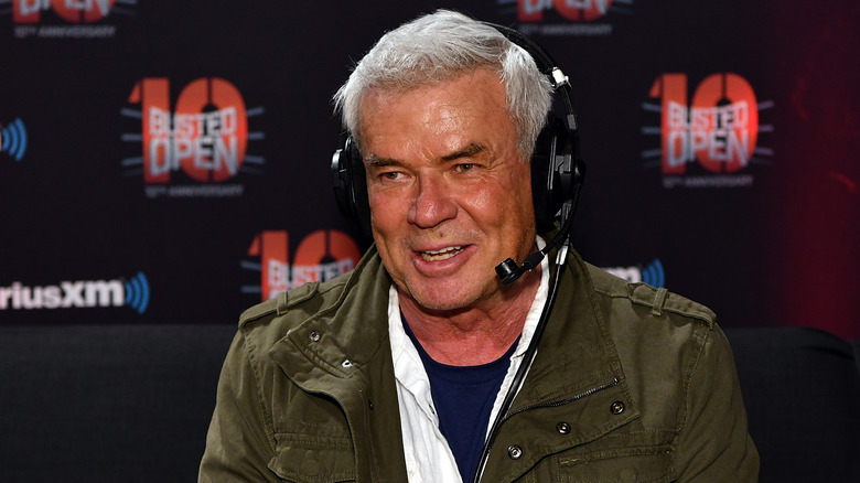 Eric Bischoff smiles on while talking to the "Busted Open" crew