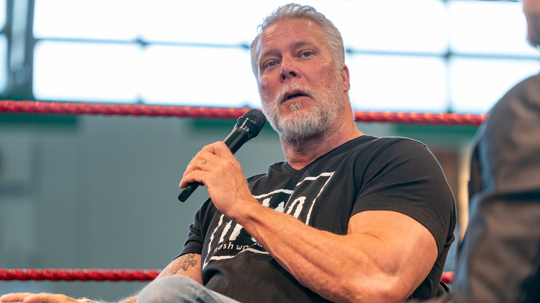 Kevin Nash talking into a microphone at an event