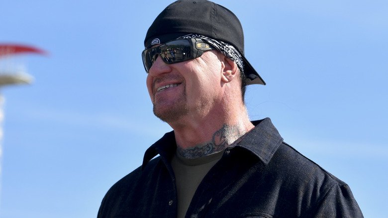 The Undertaker wearing a hat and sunglasses