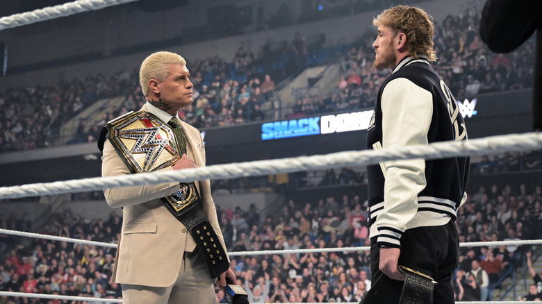 Cody Rhodes and Logan Paul stand in WWE ring