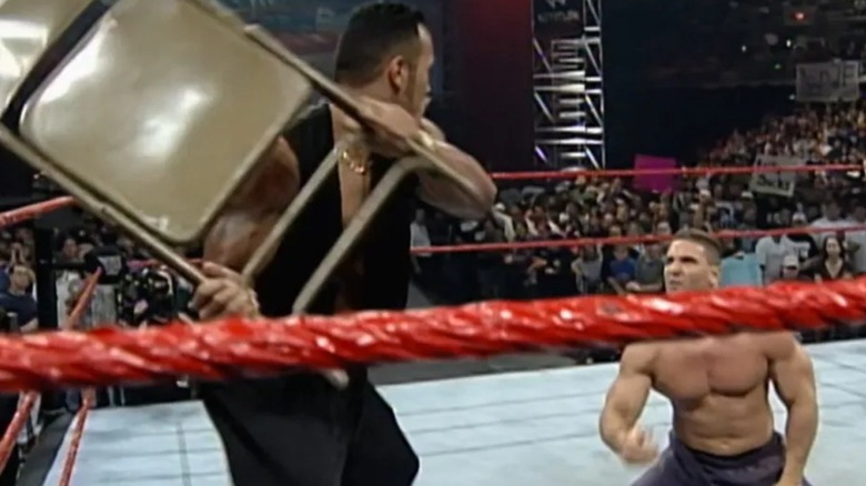 The Rock preparing to blast Ken Shamrock