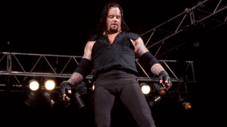 The Undertaker posing on top of the ring