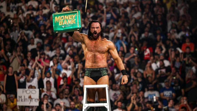 Drew McIntyre holds up Money in the Bank briefcase