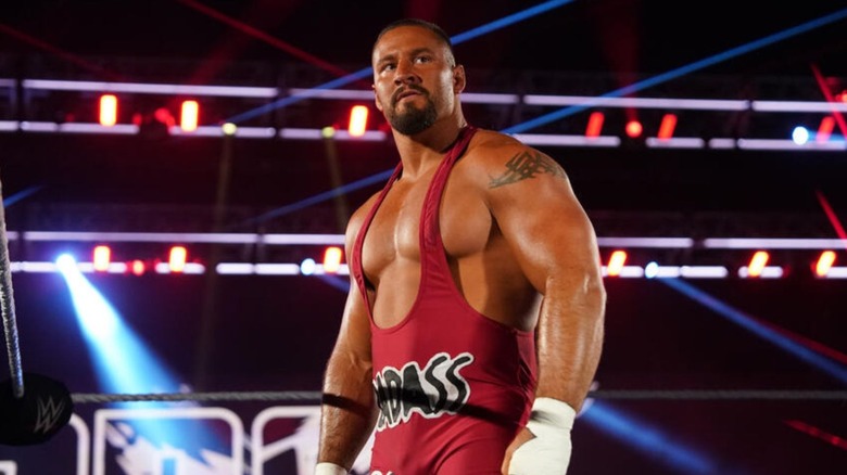 Bron Breakker stands in the middle of the ring and looks to the audience before a match on WWE TV.