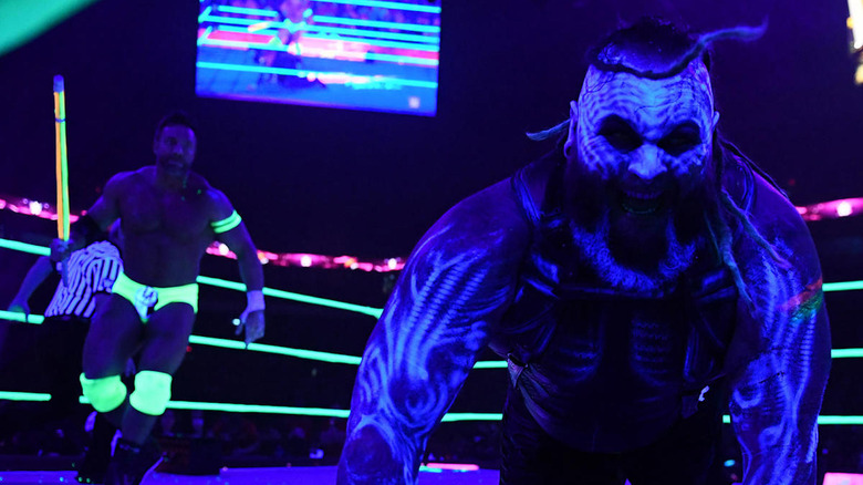 Bray Wyatt and LA Knight compete in a Pitch Black Match