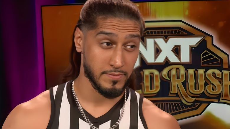 Mustafa Ali in referee shirt