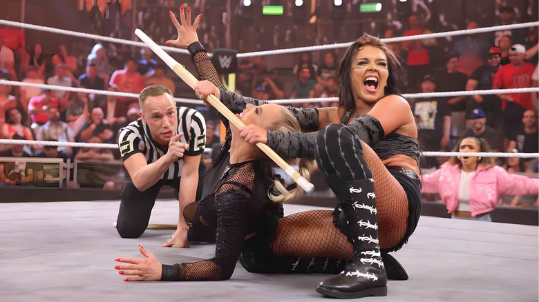 Cora Jade stretches Dana Brooke with kendo stick