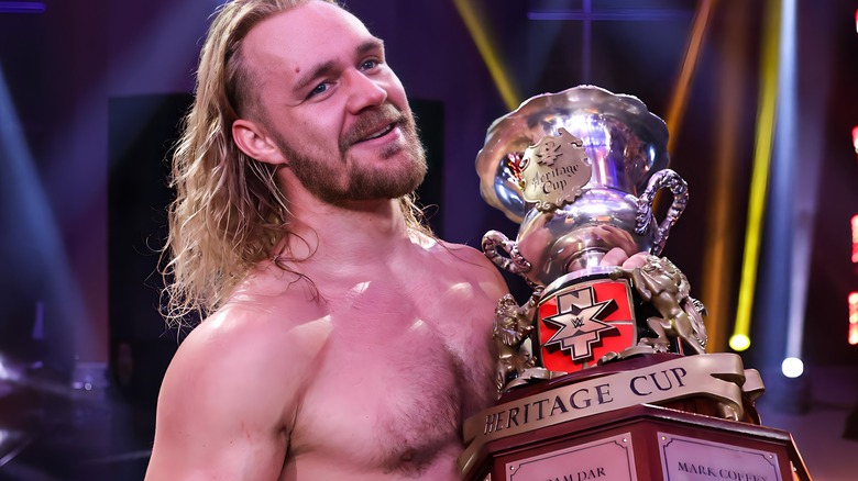 Tyler Bate holding fake Heritage Cup