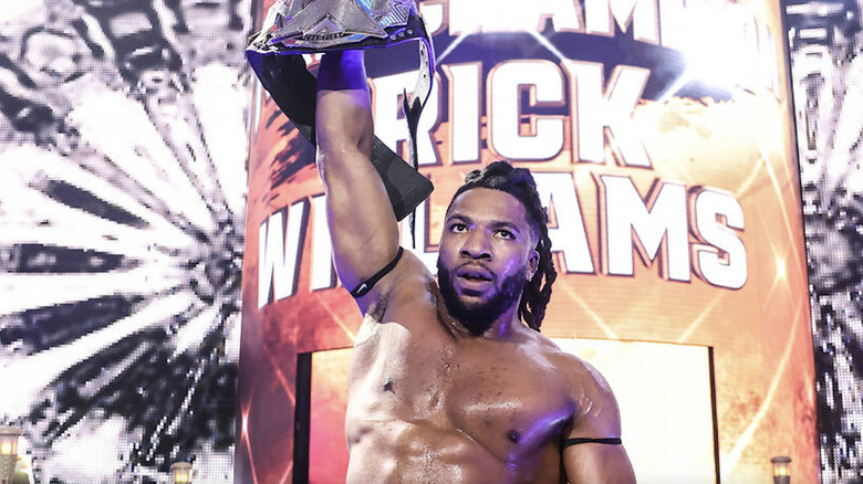 WIlliams holding up the NXT Championship