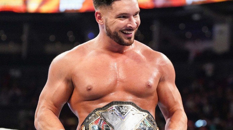 NXT Champion Ethan Page poses with the belt around his waist before a match on "WWE NXT."