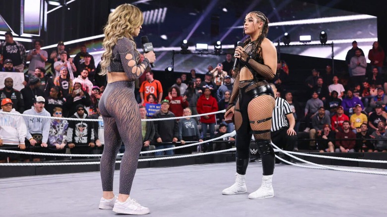 Jaida Parker stares down Lola Vice in the ring, where the rings have been half removed, as Parker accepts Vice's challenge for an NXT Underground match at Deadline.