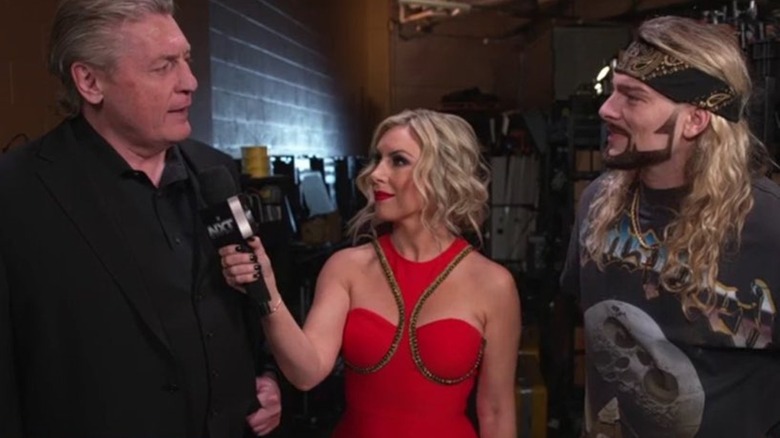 William Regal talking to Renee Young and Lexis King backstage at "WWE NXT" Halloween Havoc.