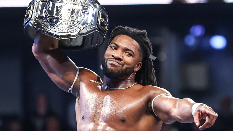 Williams holding up the NXT Championship