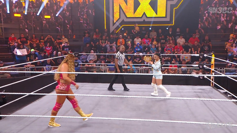 The two women facing off in the ring