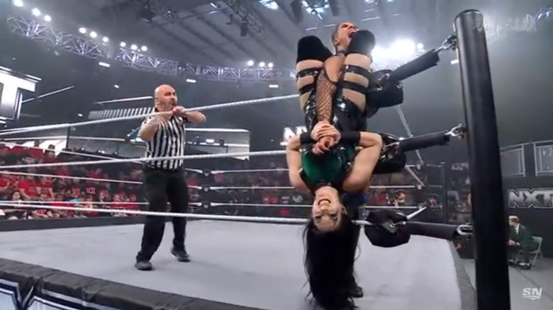 Vaquer wearing down Parker's arm using the ropes