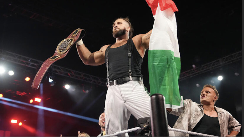 D'Angelo holding up the North American Championship and Italian flag