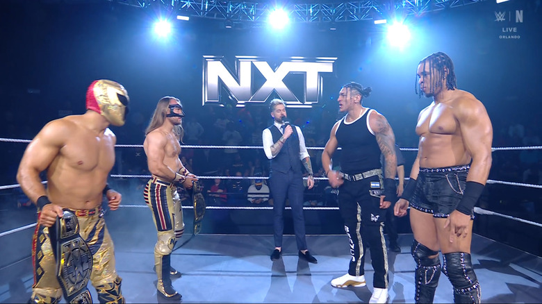 The four men staring each other down in the ring