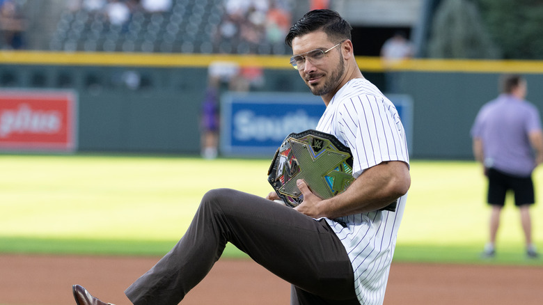 Ethan Page poses with NXT Title