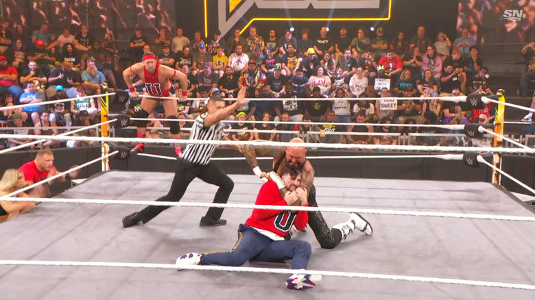 Gallows with a submission locked in on Chase