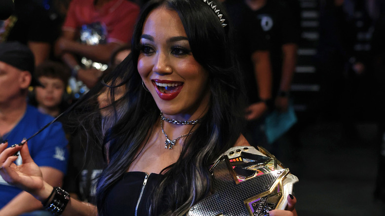 Roxanne Perez poses with title