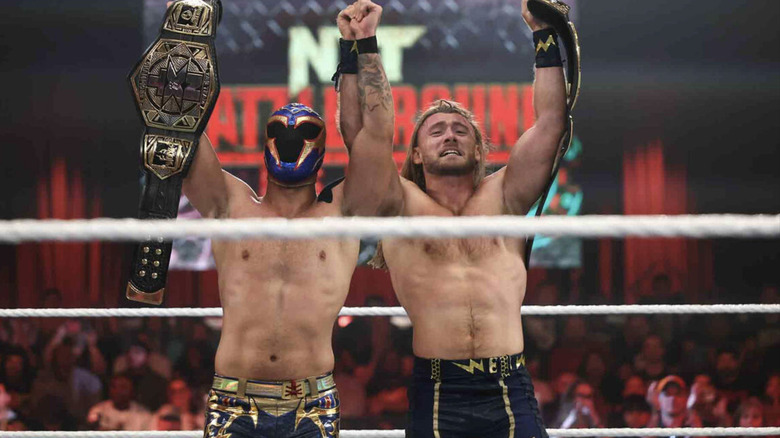 Axiom and Nathan Frazer holding up their NXT Tag Team Championship