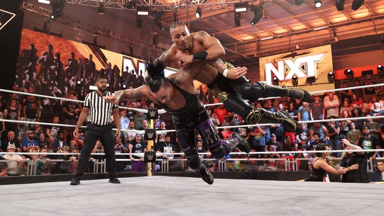 Carmelo Hayes spikes Damian Priest's face into the mat on the July 11 "NXT"