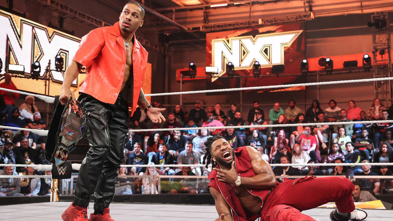 Carmelo Hayes after accidentally striking Trick Williams with the "NXT" Championship