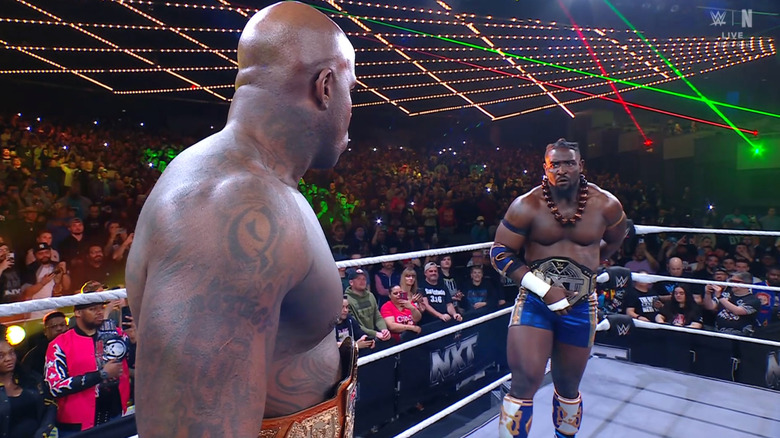 Moose and Femi staring each other down in the ring