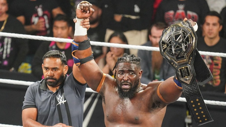 Oba Femi celebrates winning the NXT Championship for the first time