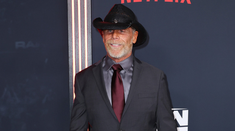 Shawn Michaels smiles on the red carpet during the Netflix premiere of 