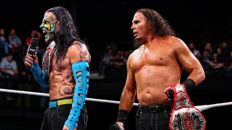 Jeff Hardy addresses NXT Tag Team Champions FrAxiom, alongside brother Matt Hardy, in the ring during an episode of 