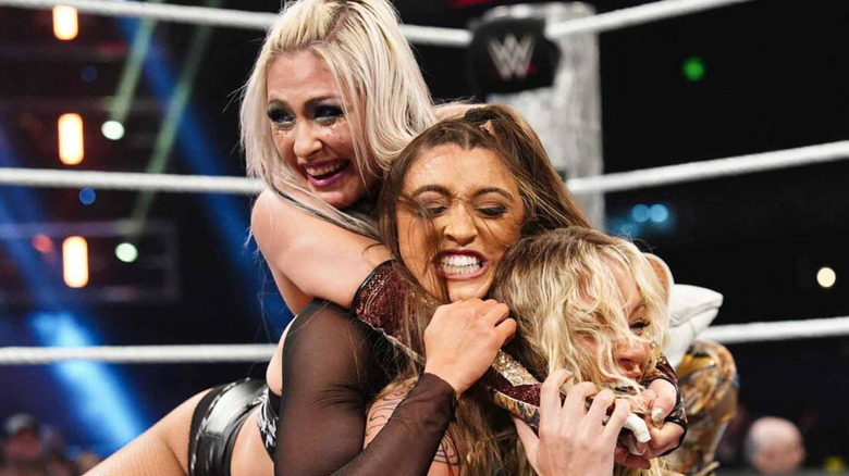 Giulia applying a crossface submission to Wren Sinclair and Sol Ruca