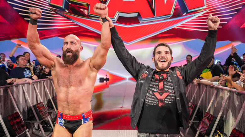 Tommaso Ciampa and Johnny Gargano raise their arms