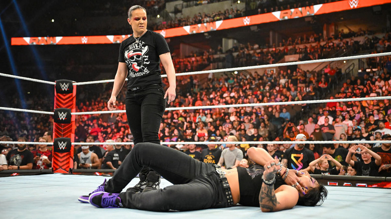 Shayna Baszler stands over Rhea Ripley