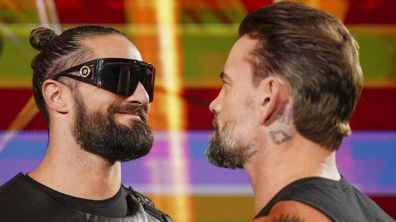 Seth Rollins stares at CM Punk