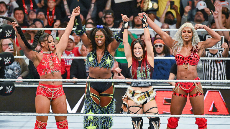 Bianca Belair, Naomi, IYO SKY, and Jade Cargill celebrate in the ring on "WWE Raw"