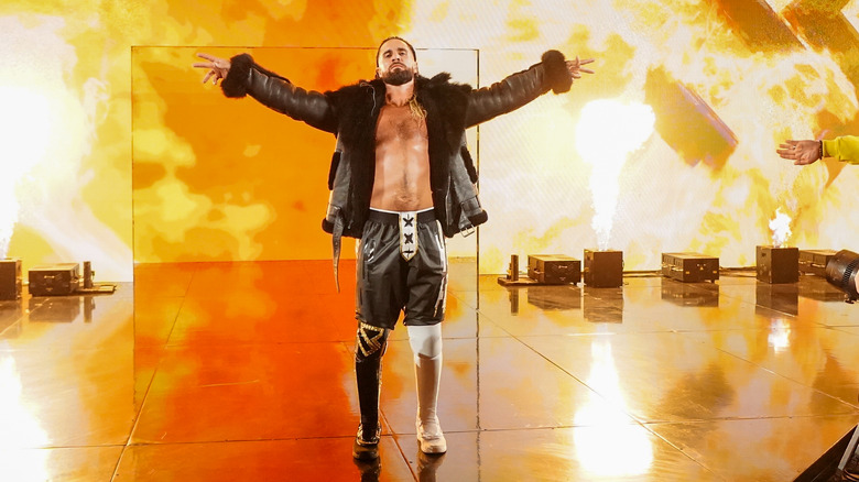 Seth Rollins poses during his entrance on "WWE Raw."