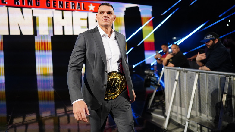 GUNTHER walks down to the ring in a suit wearing his title belt on "WWE Raw."