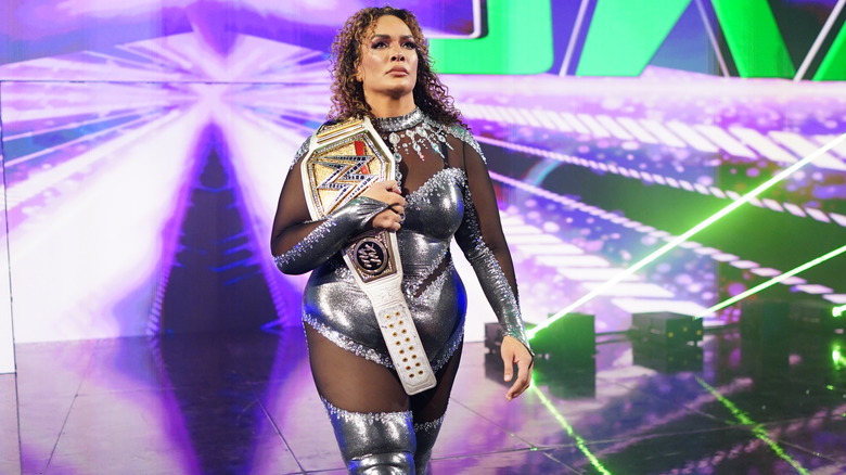 Nia Jax makes her entrance with title over her shoulder on "WWE Raw."