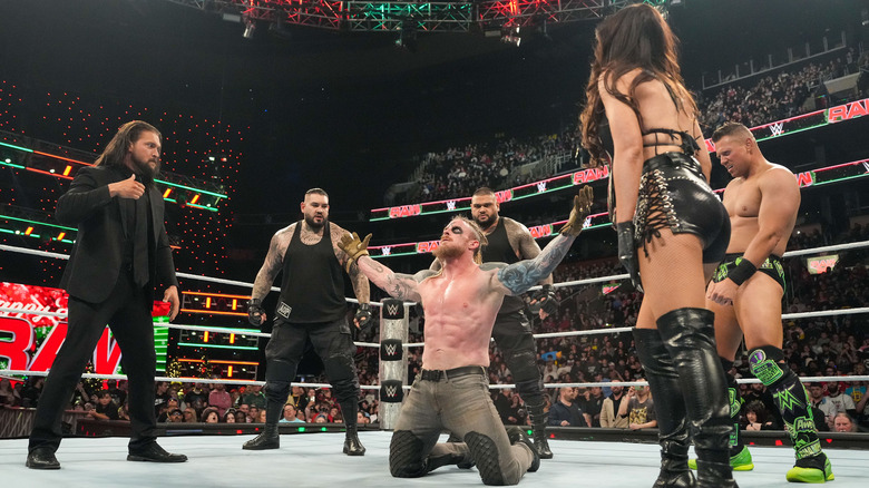 The Final Testament surrounds Dexter Lumis the in ring on "WWE Raw."