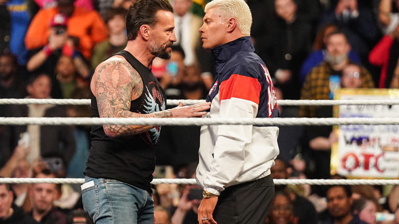 CM Punk puts a hand in the chest of Cody Rhodes on "WWE Raw"