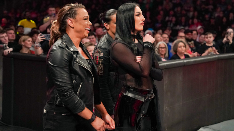 Pure Fusion Collective looking at the ring from ringside on "WWE Raw."