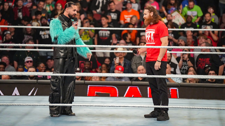 Seth Rollins speaking to Sami Zayn in the ring on "WWE Raw"