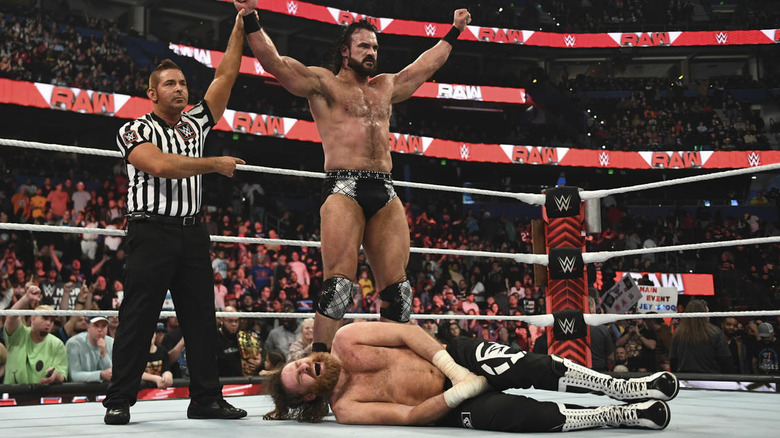 Drew McIntyre stands over a fallen Sami Zayn